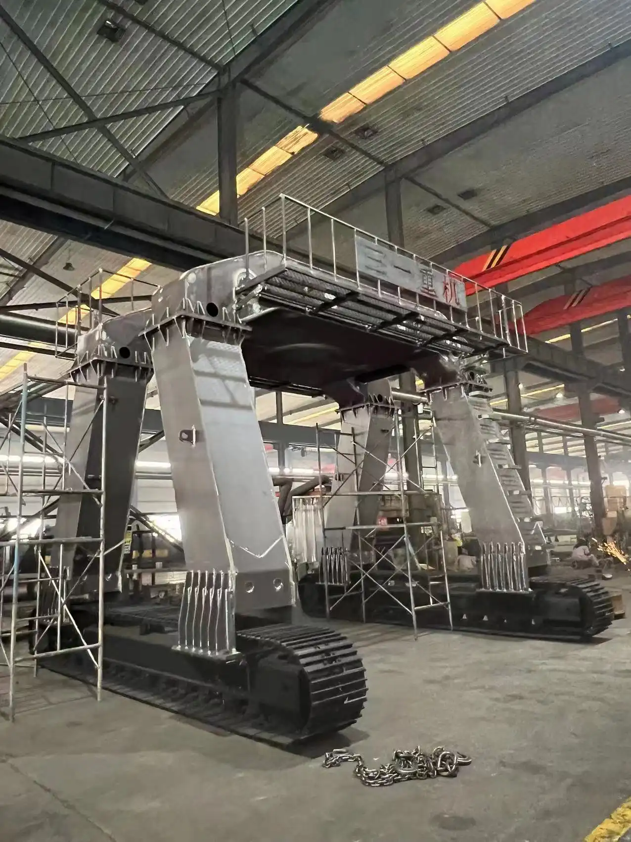 Can an excavator be modified with long legs and equipped with a large bucket?
